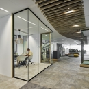 Single glass partitions wall combined with wooden door frames