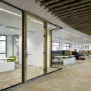 Single glass partitions wall combined with wood door frames