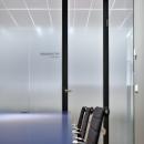 Office with glass partition with sandblast foil