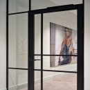 Glass partition with compartments.