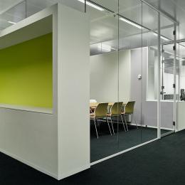 Full glass office walls combined with cabinets