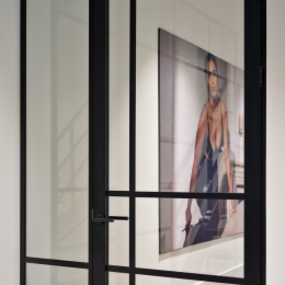 Glass partition with compartments.