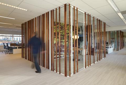 Wood construction on the glass of a office partition