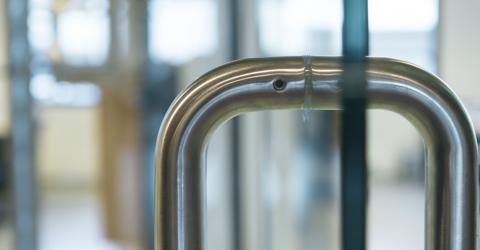 U-Shaded door handle on a glass sliding door