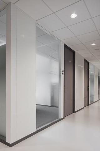 Corridor partition with steel panels and doors combined with glass panels