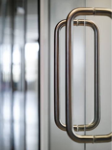 300 mm U-shaded door handle on a glass sliding door