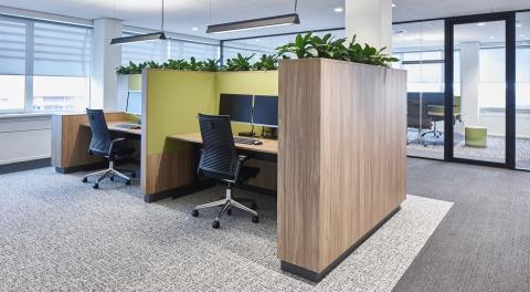 Office work desk with in the background a QbiQ glass partition