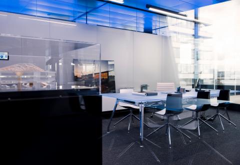 Office dividing glass wall with decorative panels