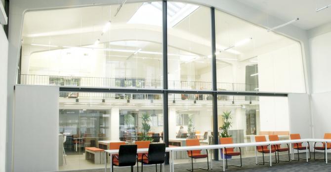 Extra high arc shape glass wall with steel construction and double doors