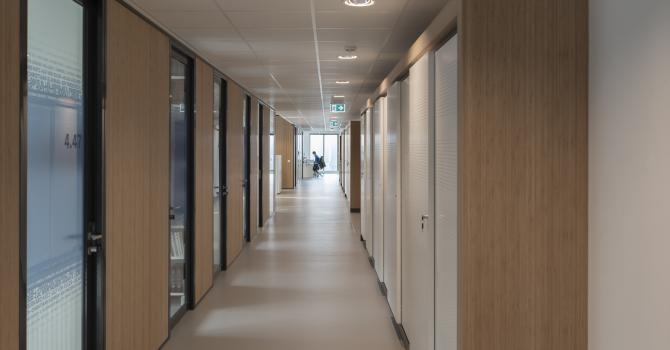 Corridor with closed partition and aluminum framed doors