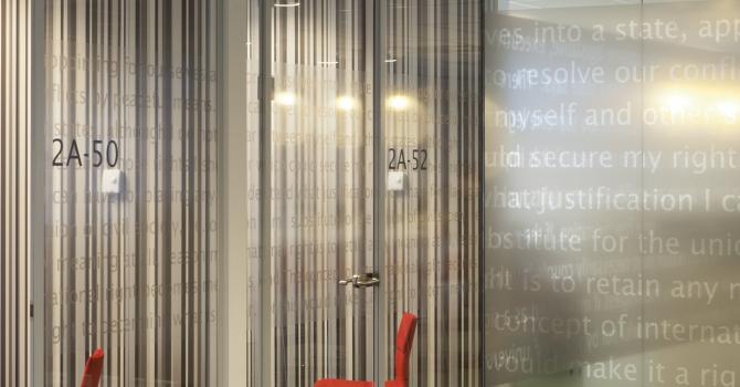 Full glass partitions wall with text design film added